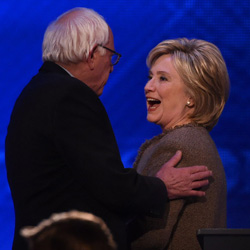Hillary Clinton and Bernie Sanders hug
