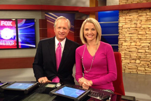 Neill McNeill on set with co-anchor Katie Nordeen