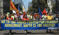 Protestors marching against the Trans-Pacific Partnership