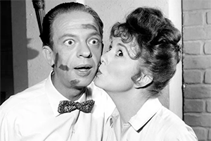 Betty Lynn as Thelma Lou kissing Don Knotts as Barney Fife in a promotional photo for The Andy Griffith Show