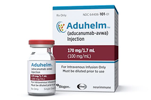 This image provided by Biogen on Monday, June 7, 2021 shows a vial and packaging for the drug Aduhelm. (Biogen via AP)