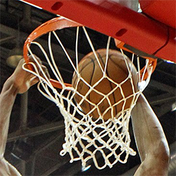 A basketball being dunked. Cropped from photo by Norma Gonzalez at flickr.com/photos/55731104@N06/8077782175