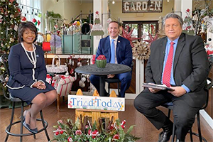 US Senate candidates Cheri Beasley and Ted Budd with Jim Longworth on the set of Triad Today. This photo was edited to show them together but they did not appear on the set at the same time.