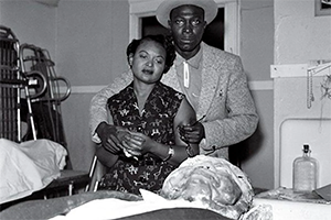 1955 photo by David Jackson of Jet Magazine showing Emmitt Till's mother, Mamie Till-Mobley looking down at her dead son's beaten and disfigured body