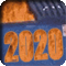 A dumpster on fire floating in floodwaters with the year 2020 on the front