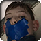 11-year-old Brady Webster with painters tape over his mouth